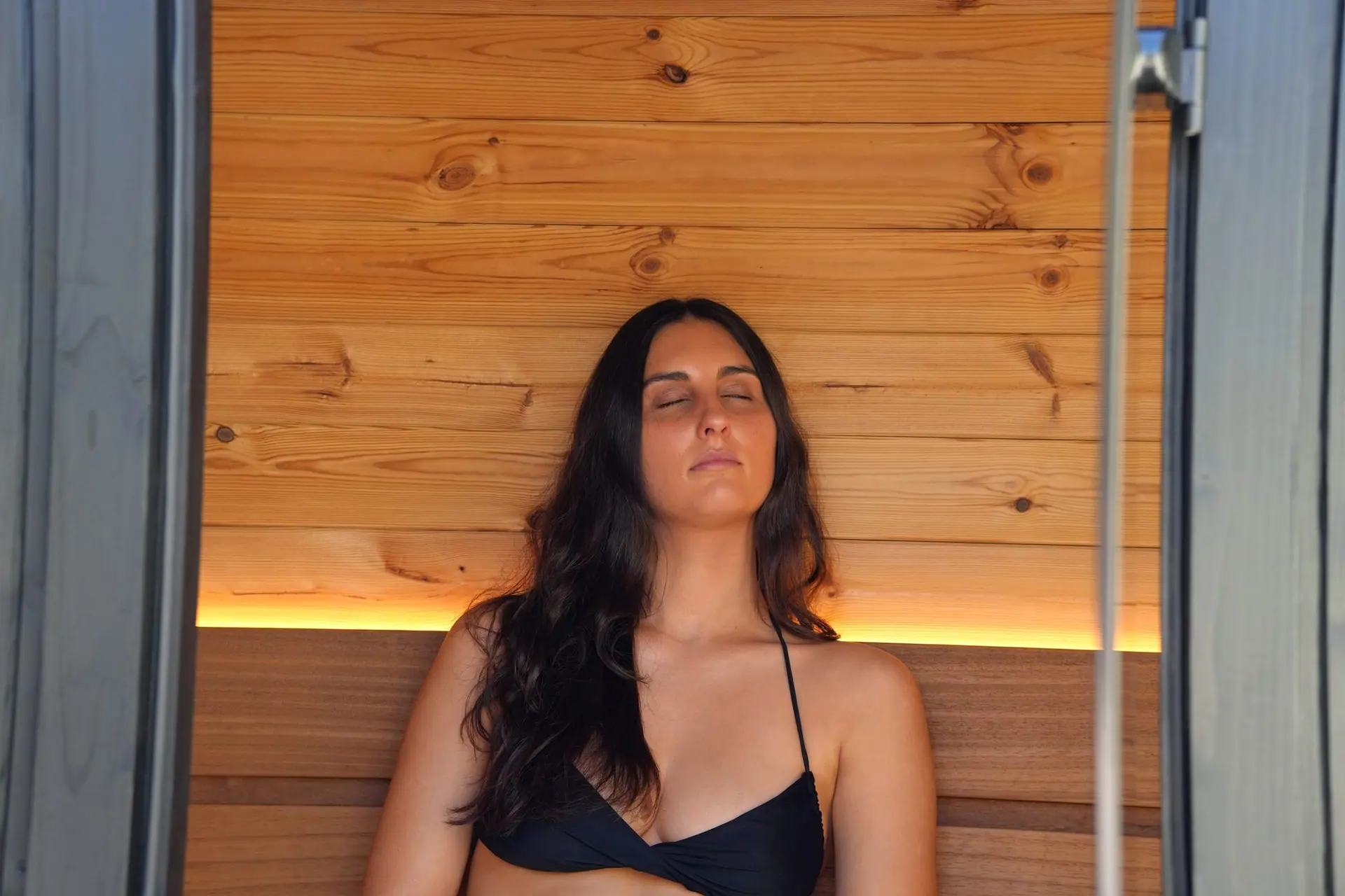 Mia resting inside the warm timber interior