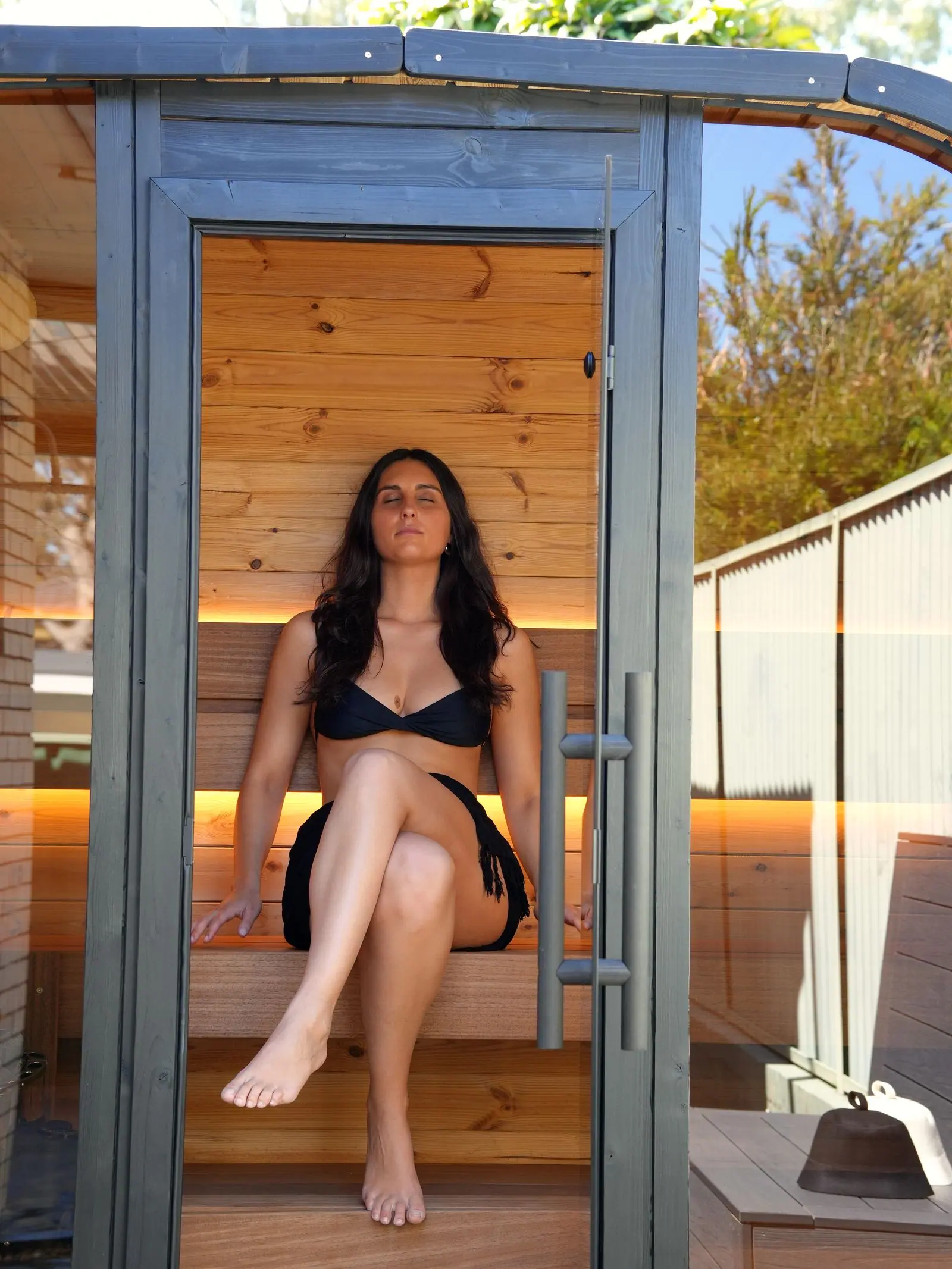 Mia seated inside the Koda glass entrance